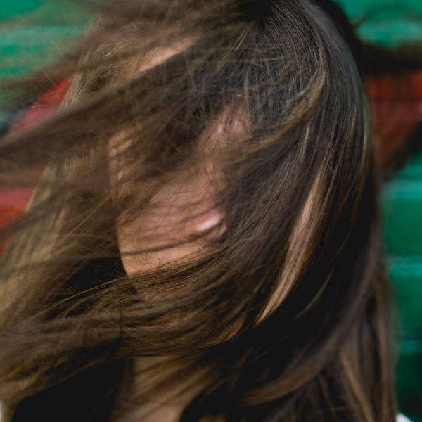 Closeup on woman's hair covering face